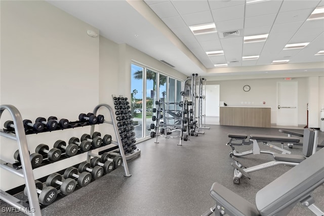 exercise room featuring a paneled ceiling