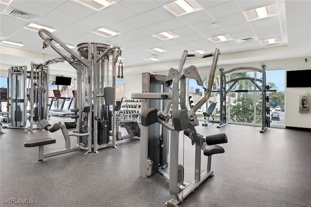 exercise room with a drop ceiling