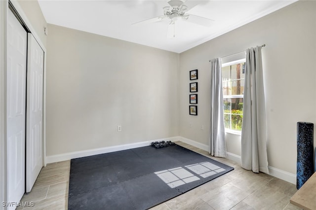 interior space with ceiling fan