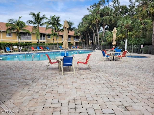 view of swimming pool with a patio area