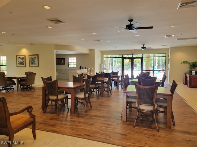 dining space featuring light hardwood / wood-style flooring and ceiling fan