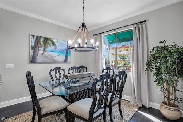 dining space featuring baseboards, dark wood-type flooring, a notable chandelier, and crown molding