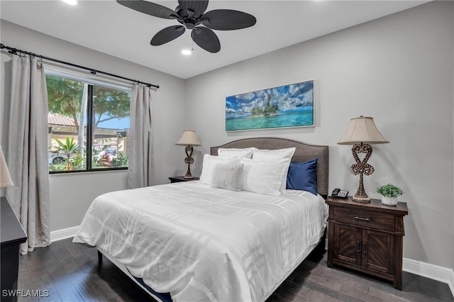 bedroom featuring dark wood-type flooring, recessed lighting, and baseboards