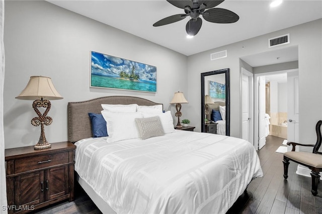 bedroom with dark wood-style floors, ceiling fan, ensuite bath, and visible vents