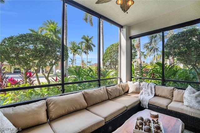 sunroom featuring ceiling fan