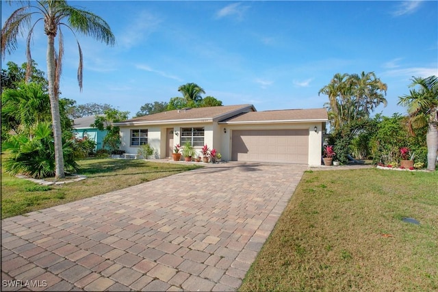 1039 Cardinal St, Naples, FL 34104 - ranch-style house with stucco siding, an attached garage, decorative driveway, and a front lawn