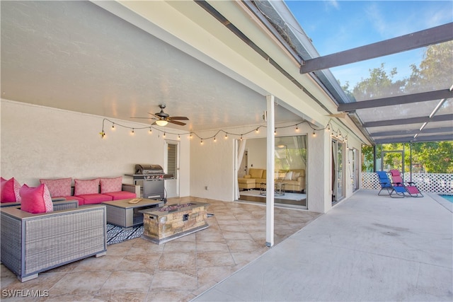 view of patio / terrace featuring a lanai, ceiling fan, grilling area, and outdoor lounge area