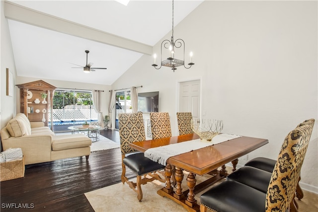 dining space with beamed ceiling, ceiling fan with notable chandelier, hardwood / wood-style flooring, and high vaulted ceiling