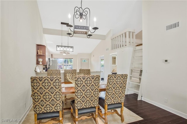 1039 Cardinal St, Naples, FL 34104 - dining space featuring visible vents, wood finished floors, baseboards, and a notable chandelier