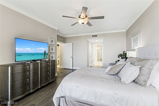 bedroom with dark wood-type flooring, crown molding, visible vents, and baseboards