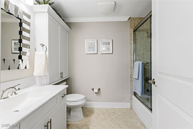 full bathroom with toilet, shower / bath combination with glass door, crown molding, baseboards, and vanity