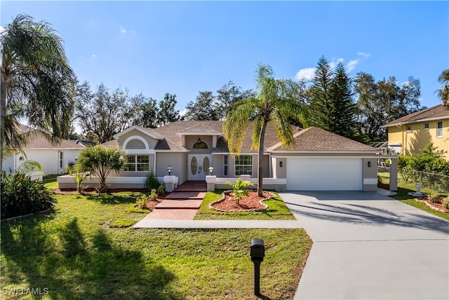 view of front facade featuring a garage and a front lawn