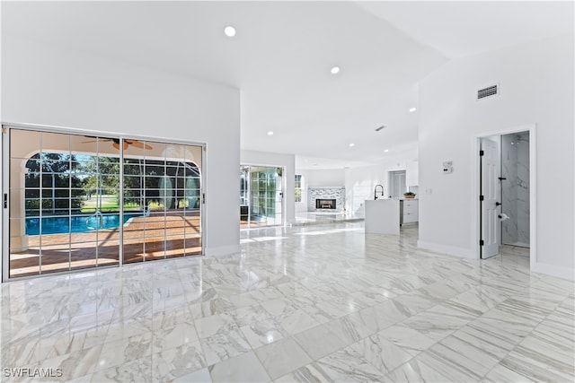 unfurnished living room with vaulted ceiling