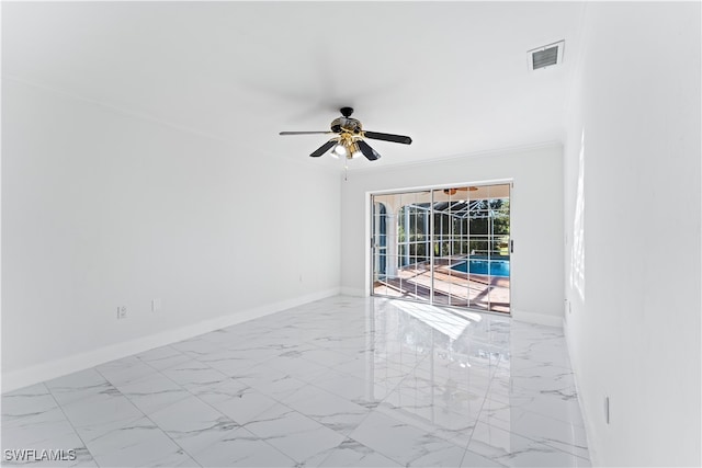 unfurnished room featuring ceiling fan and crown molding