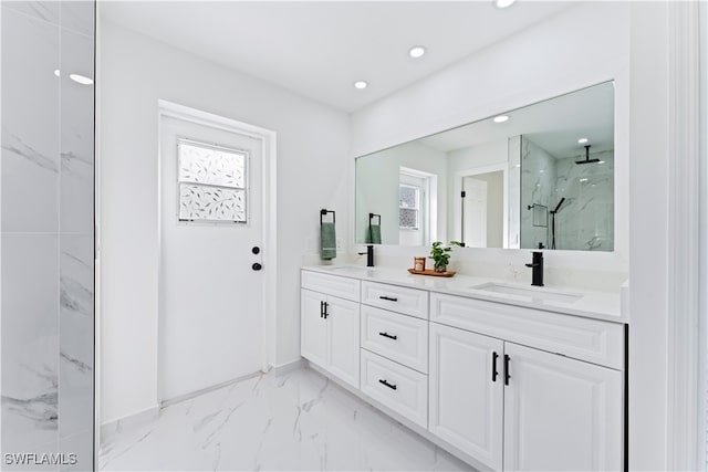 bathroom with walk in shower and vanity