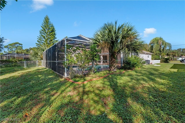 view of yard featuring glass enclosure