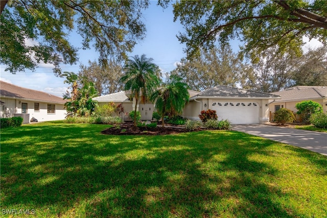 ranch-style home with a garage and a front lawn