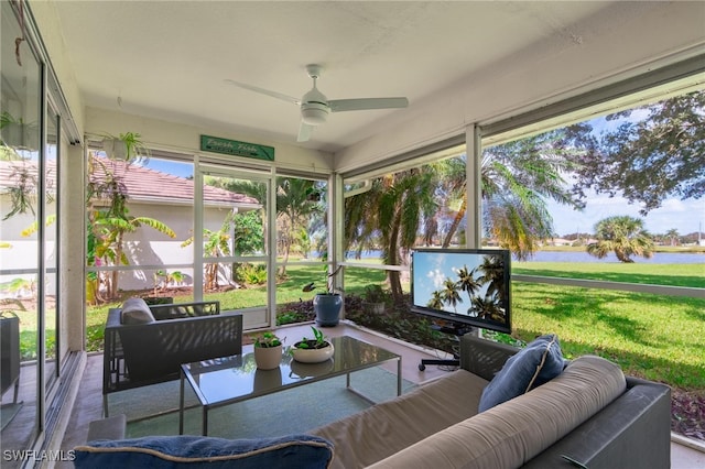 sunroom / solarium featuring ceiling fan and a wealth of natural light