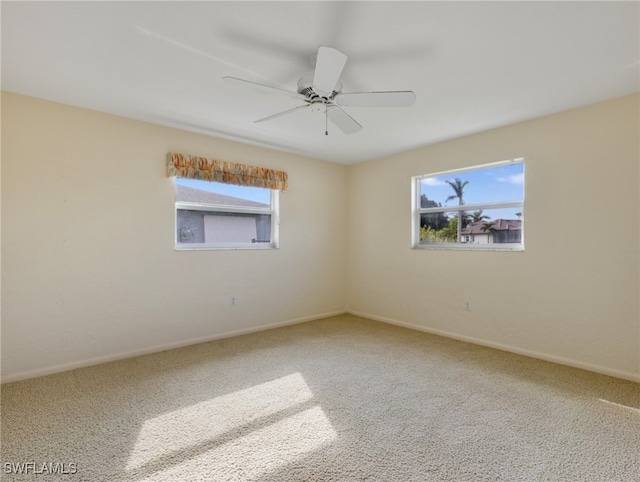 empty room with carpet flooring and plenty of natural light