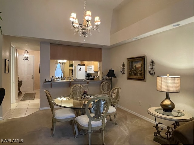 carpeted dining room featuring an inviting chandelier