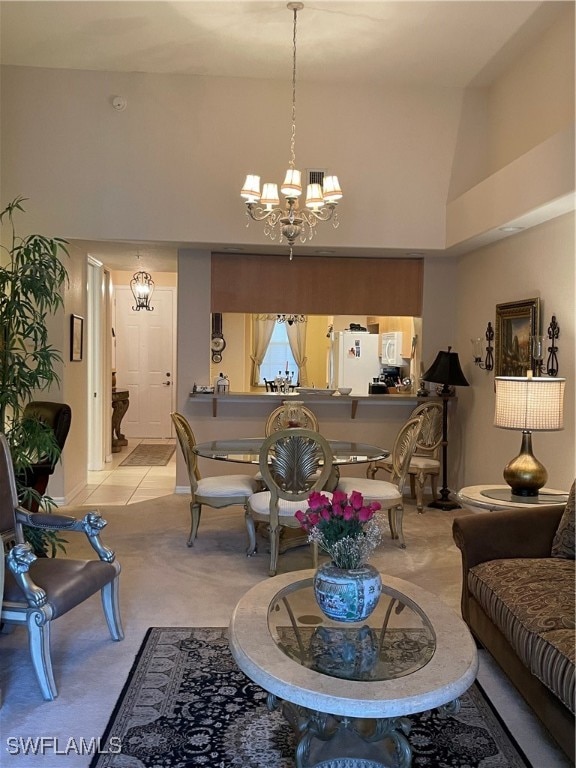 carpeted living room featuring a chandelier and high vaulted ceiling