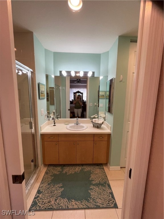 bathroom with vanity, tile patterned floors, and walk in shower