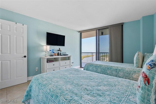 380 Seaview Ct Unit 1808, Marco Island, FL 34145 - tiled bedroom with access to exterior and baseboards