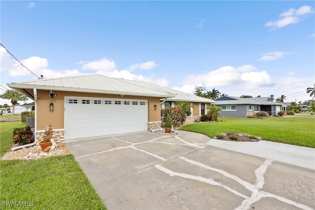 ranch-style house featuring a garage and a front lawn