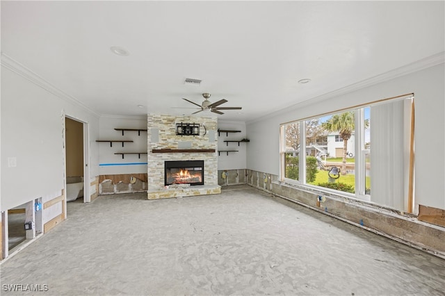 unfurnished living room featuring crown molding, a fireplace, and ceiling fan