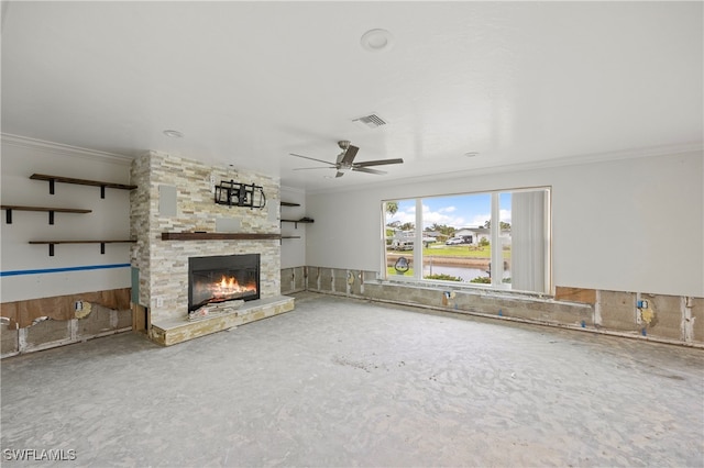 unfurnished living room with a water view, ceiling fan, ornamental molding, and a fireplace