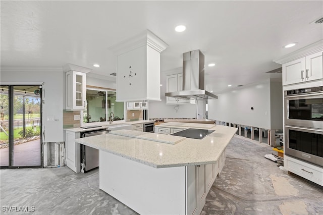 kitchen featuring wall chimney range hood, decorative backsplash, appliances with stainless steel finishes, white cabinetry, and light stone counters