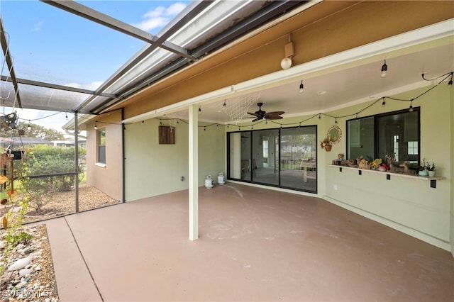 view of patio / terrace featuring a lanai and ceiling fan