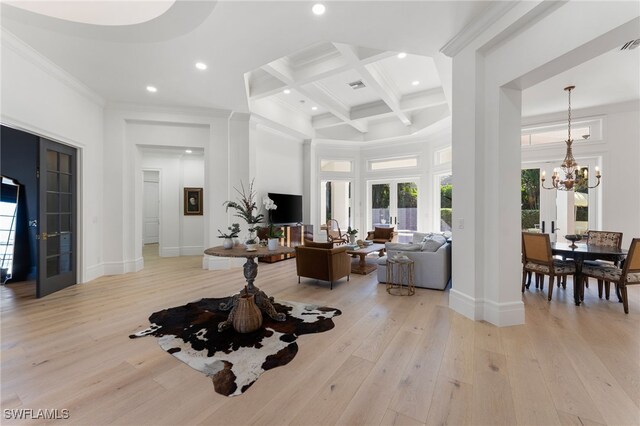 living room with french doors, coffered ceiling, beam ceiling, an inviting chandelier, and light hardwood / wood-style floors