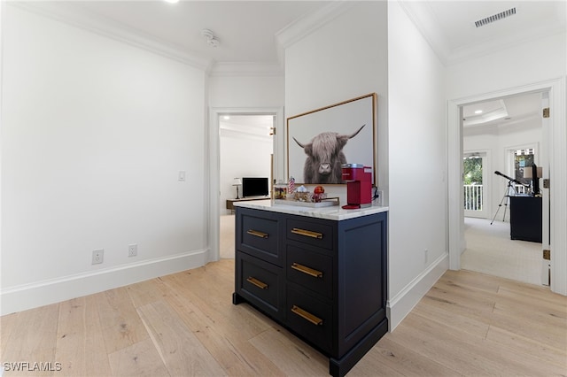 hallway with crown molding and light wood-type flooring