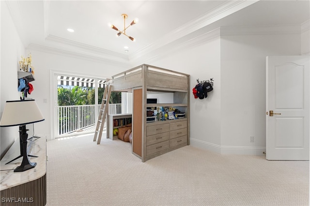 carpeted bedroom featuring a chandelier, access to exterior, crown molding, and a tray ceiling