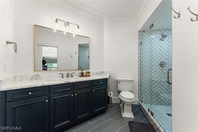 bathroom featuring tile patterned floors, crown molding, toilet, a shower with door, and vanity