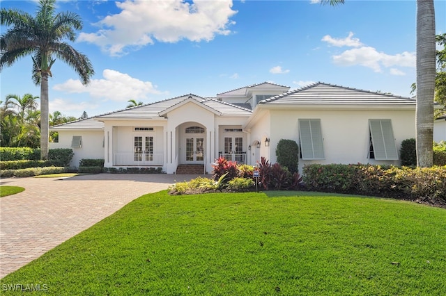 view of front of house featuring french doors and a front lawn