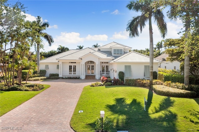 view of front facade with french doors and a front yard