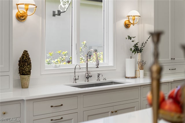 interior space with hanging light fixtures and sink