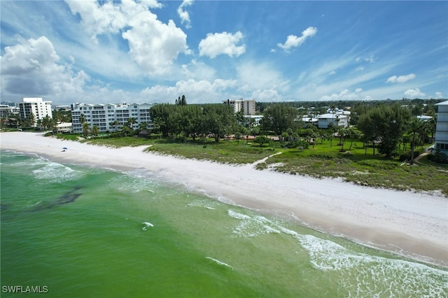 birds eye view of property with a beach view and a water view