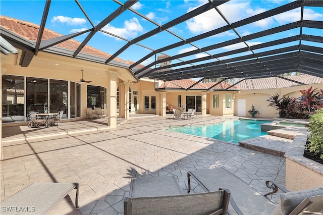 view of pool featuring a lanai, a patio area, and ceiling fan