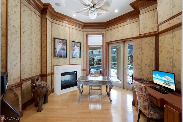 office space featuring french doors, a multi sided fireplace, ceiling fan, ornamental molding, and light hardwood / wood-style floors