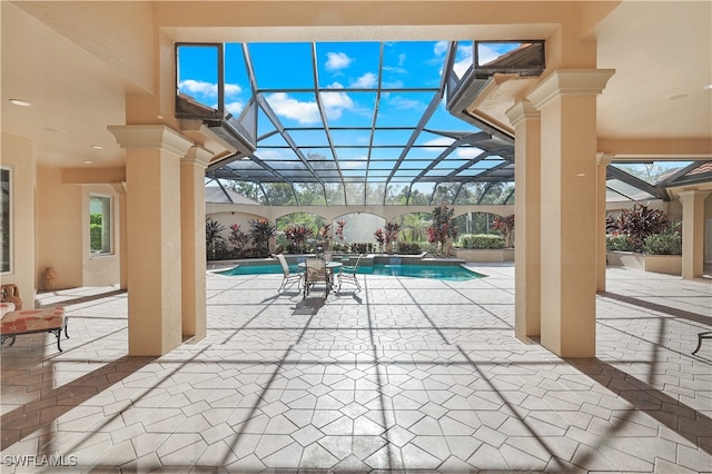 view of patio / terrace with a lanai