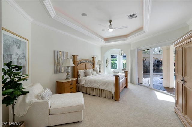 carpeted bedroom featuring a raised ceiling, ceiling fan, access to exterior, and ornamental molding