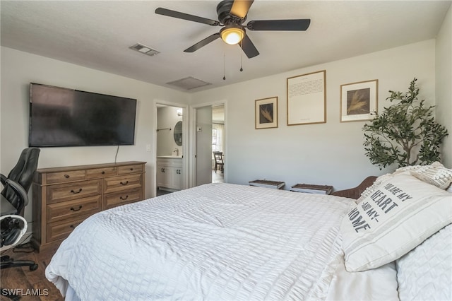 bedroom with connected bathroom, hardwood / wood-style flooring, and ceiling fan