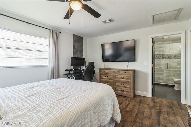 bedroom with dark wood-type flooring, connected bathroom, and ceiling fan