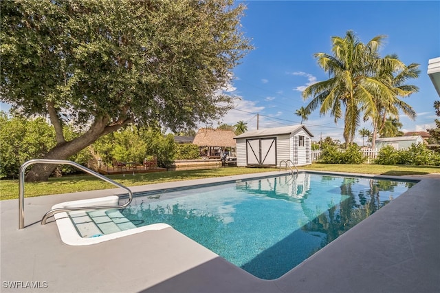 view of pool featuring a storage shed