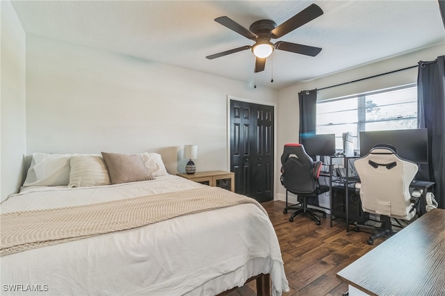 bedroom featuring dark hardwood / wood-style floors, a closet, and ceiling fan