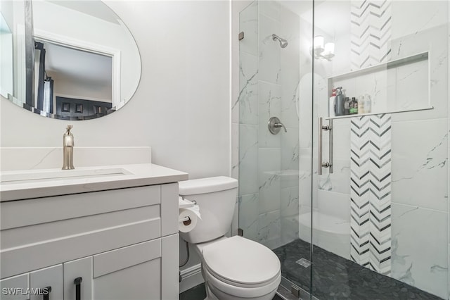 bathroom with vanity, toilet, and an enclosed shower