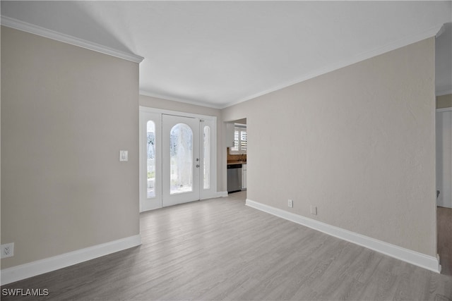 foyer featuring crown molding and wood-type flooring